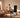 Man exercising on an AEKE smart home gym mirror in a sunny living room.
