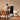A man is exercising at home in front of a touchscreen fitness mirror.