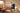 Man using AEKE smart fitness mirror for arms strength training at home